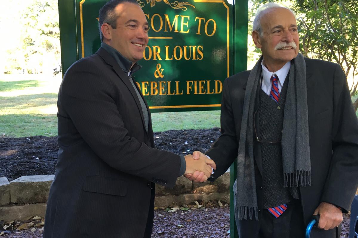 Mayor DeBell with Mayor Spango next to sign