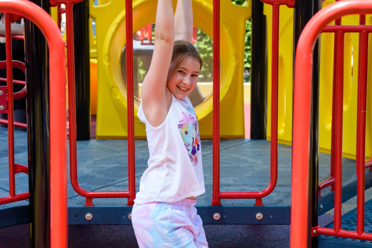 child on playground equipment