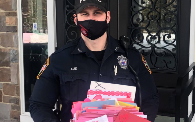 Officer delivering cards